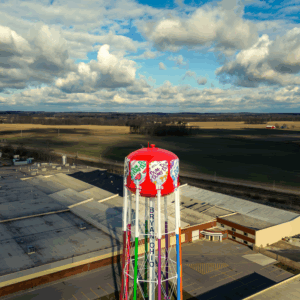 Dum-Dums water tower in Bryan, Ohio with surrounding farmland and factory buildings