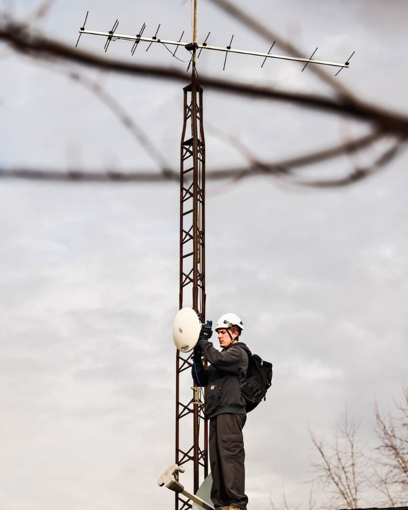 MetaLINK technician installing wireless equipment on a broadcast tower