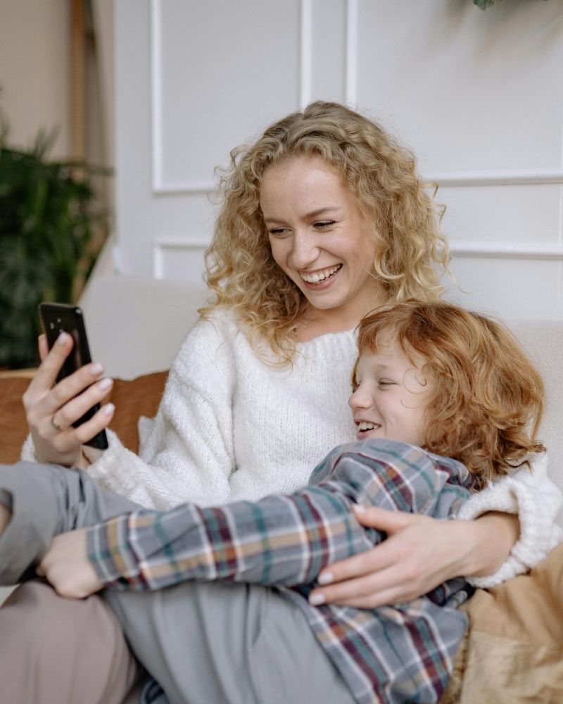 Smiling mother and child enjoying a video call over a fast internet connection in Montpelier, Ohio.