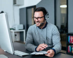 MetaLINK customer support representative wearing headset assisting residential internet customer