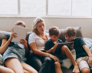 family using tablets at home streaming MetaLINK TV on multiple devices