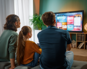 Family watching TV together at home using MetaLINK TV streaming and entertainment services