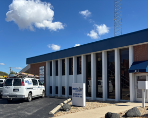 MetaLINK Technologies office building in Defiance, Ohio with company service van parked outside on a sunny day