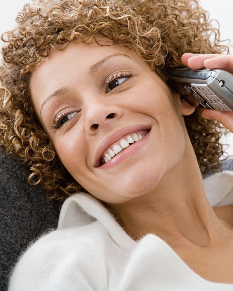 Customer enjoying clear calls with MetaLINK home phone service in Northwest Ohio and Northeast Indiana.